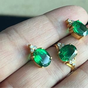 3 carat each Emerald set in 18k yellow gold with natural diamonds